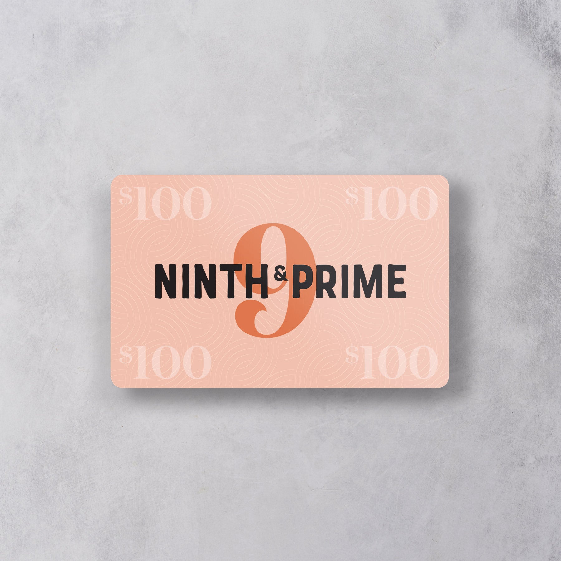 A $100 Digital Gift Card from Ninth & Prime features a peach-hued rectangular design with $100 in each corner, a central number 9, and NINTH & PRIME branding—delivered conveniently via email.