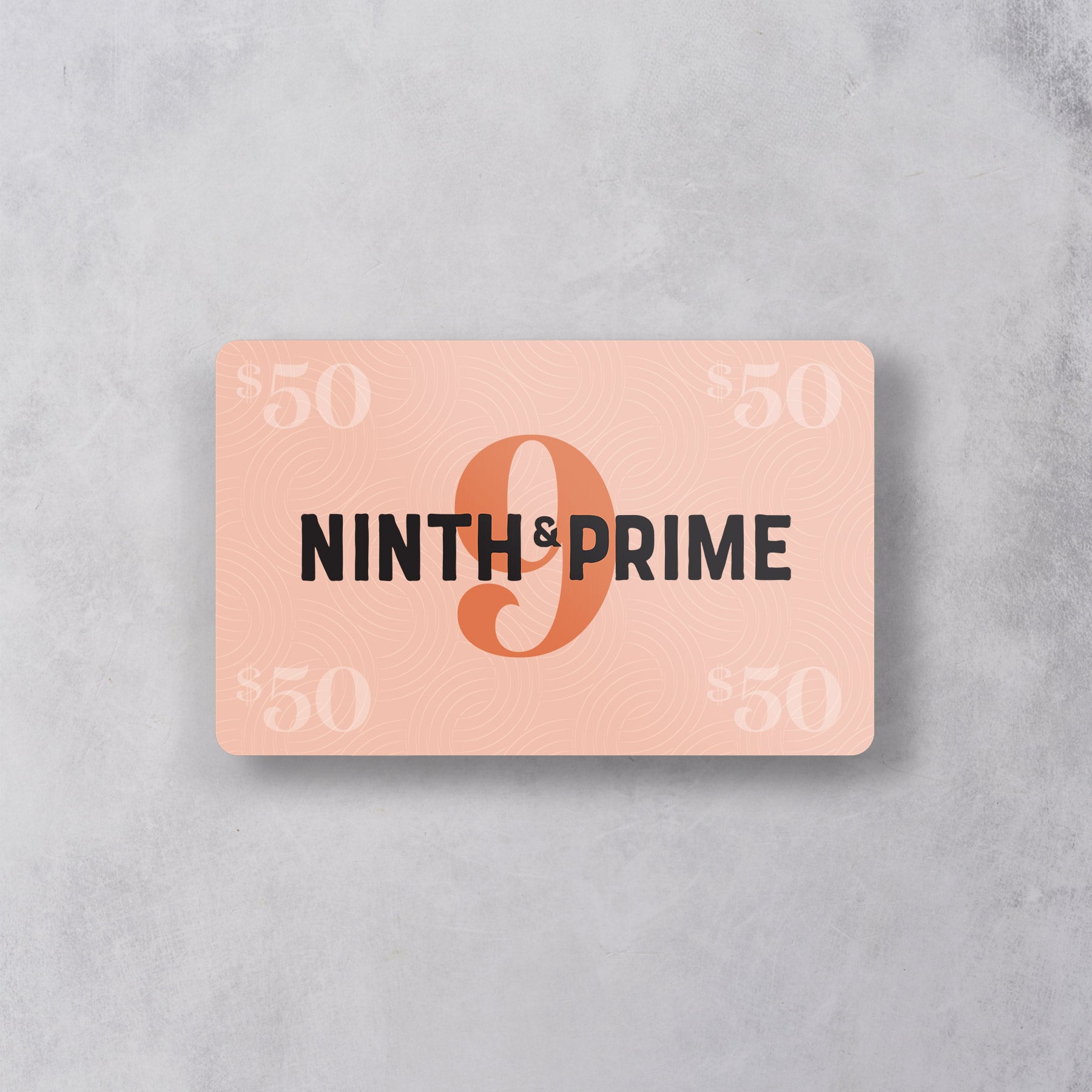 The $50 Digital Gift Card from Ninth & Prime features a peach design with “Ninth & Prime” and a large “9” at its center, “$50” in each corner, and a subtle wavy pattern—perfect for gifting by email.